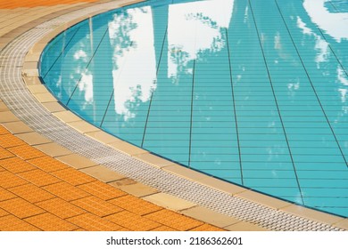 Empty Indoors Children Swimming Pool, Public Swimming Pool In Fitess Club. Children Swimming Pool With Sunny Reflections