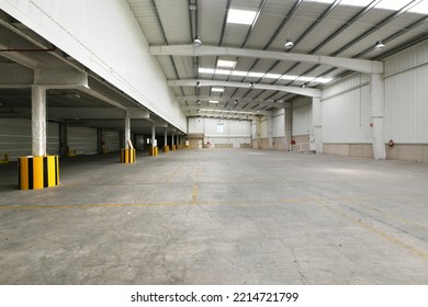 Empty Industrial Building With Cement Floors, Rib-shaped Beams Of Precast Concrete