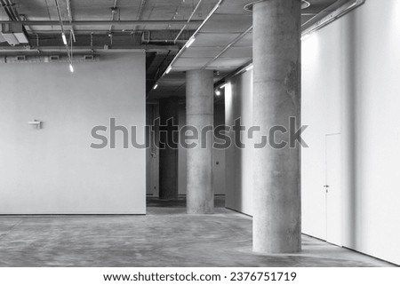 Empty industrial interior with concrete pillar and neon lights, abstract modern architecture background photo