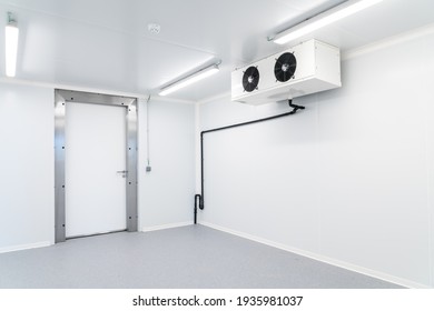 An Empty Industrial Room Refrigerator With Four Fans