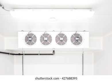 An Empty Industrial Room Refrigerator With Four Fans