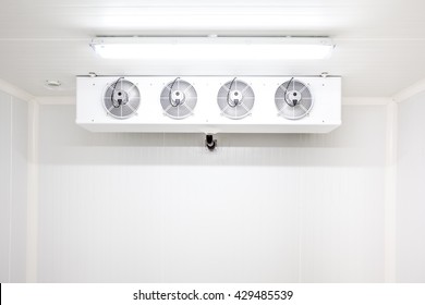 An Empty Industrial Room Refrigerator With Four Fans