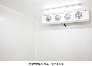 An Empty Industrial Room Refrigerator With Four Fans