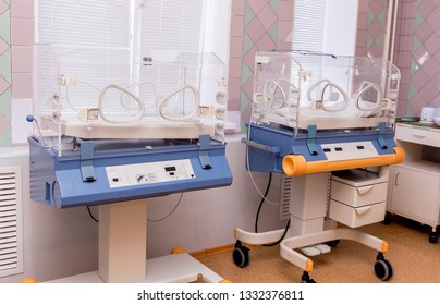 Empty Infant Incubator In An Hospital Room. Nursery Incubator In Hospital. Box For Carrying Premature Babies