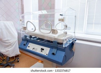 Empty Infant Incubator In An Hospital Room. Nursery Incubator In Hospital. Box For Carrying Premature Babies