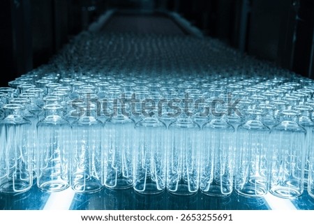 empty injection vials pharma grade injection glass vials to be filled with medical chemical drugs in an injection manufacturing line inside a healthcare pharma industry factory	
