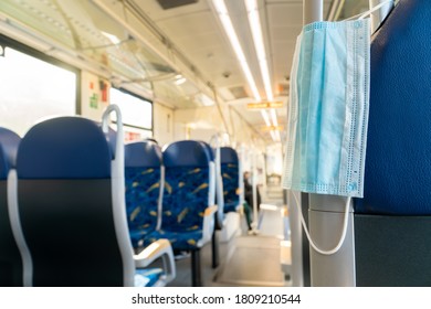 Empty inside train bus subway public transport with window view and blue seats people tourist new normal social distancing safe travel with hygiene face mask protect from covid corona virus