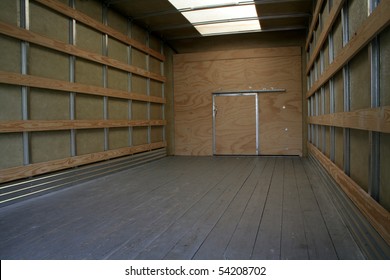 The Empty Interior Of The Back Of A Moving Truck.