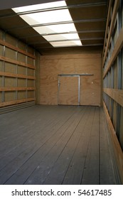 The Empty Interior Of The Back Of A Moving Truck.