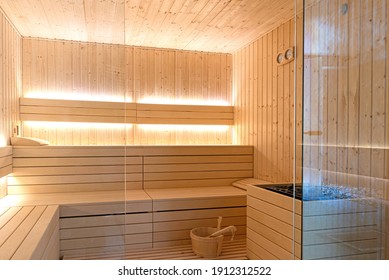 Empty interior of traditional Finnish sauna room. Modern wooden spa therapy cabin with hot dry steam