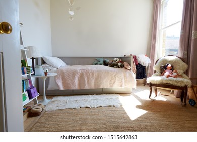 Empty Interior Of Young Girls Bedroom With Desk And Storage