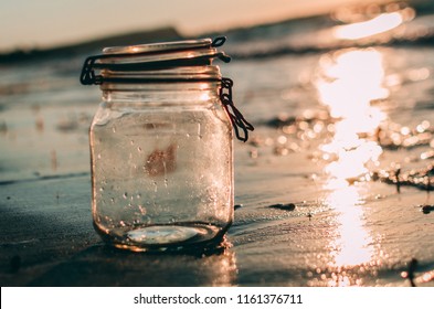 Empty Jar On The Beach