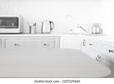 Empty Kitchen Island With Wooden Surface In Foreground, White Modern Countertop With Drawers And Microwave Oven, Lots Of Cups On Wall, Blurred Background