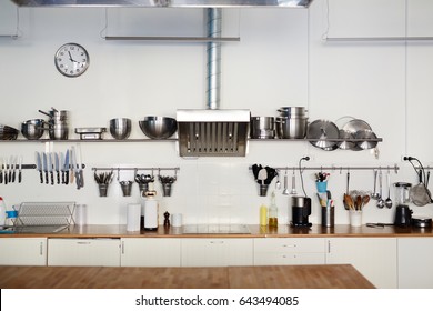 Empty Kitchen With Steel Utensils And Supplies