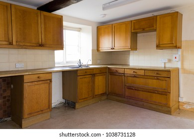 An empty kitchen in a vacant house - Shutterstock ID 1038731128