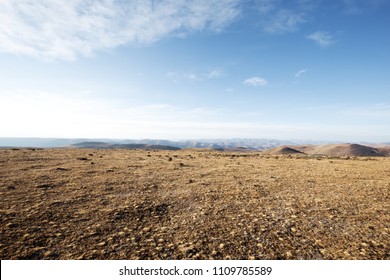 Empty Land With Blue Sky On The Mountain