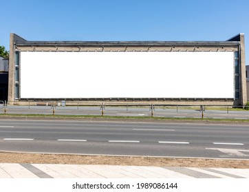 An Empty Large Horizontal Billboard Next To A Street In The City