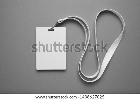 Empty layout layout. Common blank label name tag hanging on neck with thread.