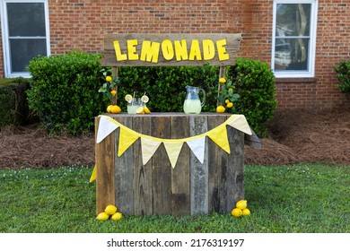 An empty lemonade stand ready for children to start selling lemonade on a hot summer day as their first business endeavor.