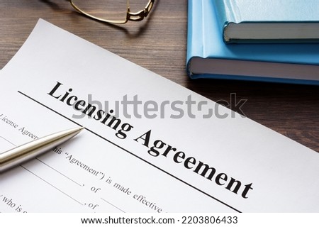 Empty licensing agreement application form and pen.