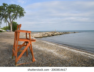 Empty Lifeguard Chair On Quiet Lakeshore Beach