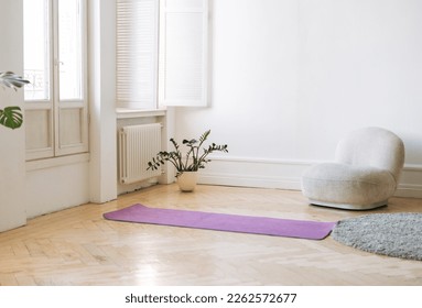 Empty living room with fitness mats on floor - Powered by Shutterstock