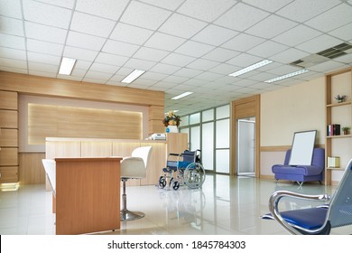 Empty Lobby Hospital Counter And Wheelchair For Patient Healthcare Service