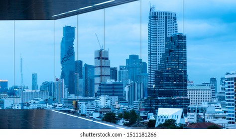 Empty Loft Unfurnished Modern Interior Office With City Skyline And Buildings City From Frameless Glass Window