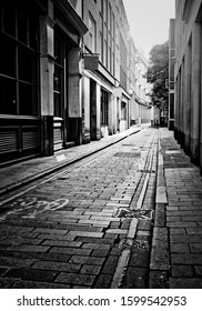 Empty London Side Street With Neo Noir Black And White Poster Effect