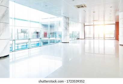 Empty long corridor in modern office building. - Shutterstock ID 1723539352