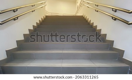 Empty long stair in office building. Abstract steps. Stairs in the city.