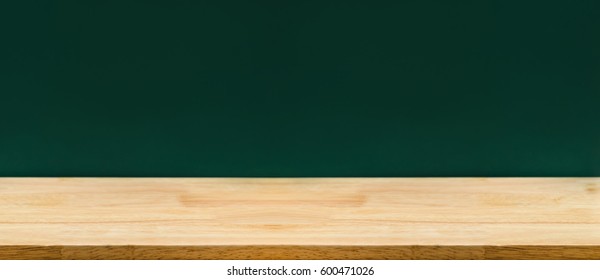 Empty Long Wood Table Top With Green Blackboard At Background,Mockup Template For Adding Or Display Of Product,Education Concept