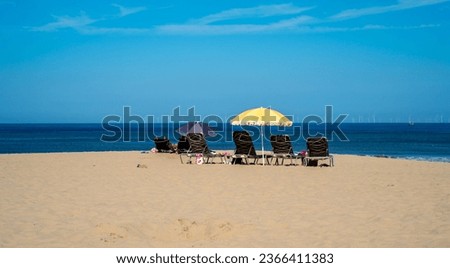 Empty longchairs on the beach in Scheveningen, Netherlands
