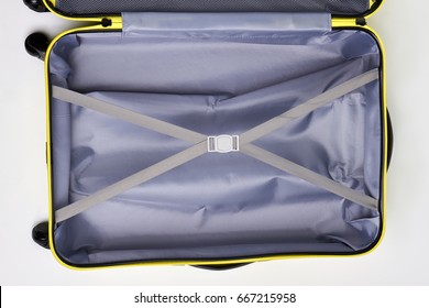 Empty Luggage With Crossed Belts. Open Suitcase For Travel, Top View.