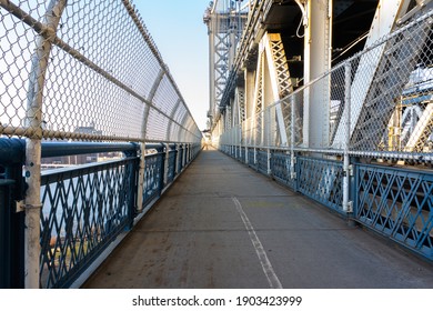 Empty Manhattan Bridge Walkway in New York City. Suspension bridge that connects Manhattan with Brooklyn with walking path, subway tracks and car roads