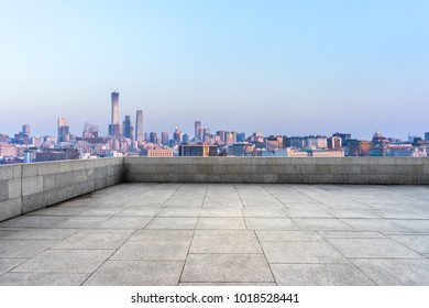 empty marble floor with panoramic cityscape - Shutterstock ID 1018528441