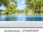 Empty marble table top with blur outdoor swimming pool in tropical resort hotel summer background
