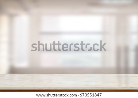 Empty Marble table top or marble counter in blurred empty office bacground. For product display montage.