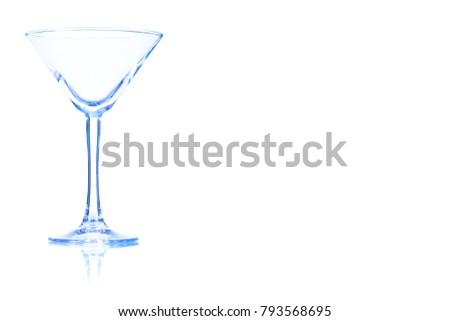 Empty the Martini glass toned in blue colorisolated on a white background. Place for your text.