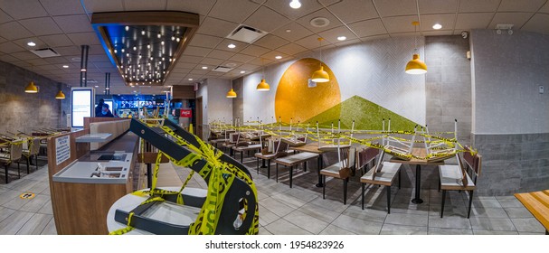 Empty McDonald's Restaurant, Indoor Dining Restrictions In New York City, Seating Space Covered By Yellow Tape, In The Bronx, New York, United States 4.12.2021