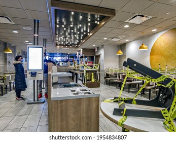 Empty McDonald's Restaurant, Indoor Dining Restrictions In New York City, Seating Space Covered By Yellow Tape, In The Bronx, New York, United States 4.12.2021