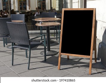 Empty Menu Board Stand And Outdoor Cafe