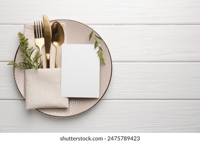 Empty menu, plate, cutlery, napkin and floral decor on white wooden table, top view. Mockup for design - Powered by Shutterstock