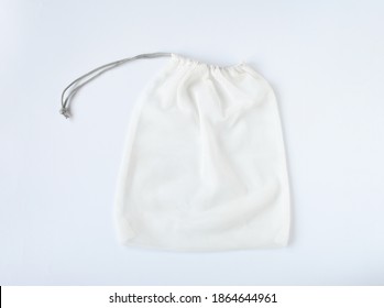 Empty Mesh Shopping Bag, White Net String On White Background. Bag Contain Vegetable Or Fruit, Reuseable And Washable, Eco Market Bag Concept.