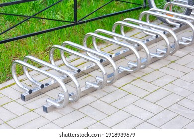 Empty Metal Bike Rack In Parking Lot Of Campus