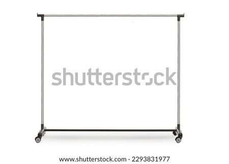 Empty metal clothing rack with wheels isolated on white background