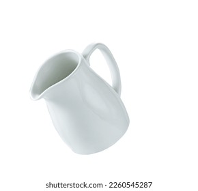 Empty milk pitcher or creamer isolated on white background.