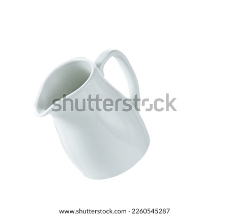 Empty milk pitcher or creamer isolated on white background. Imagine de stoc © 