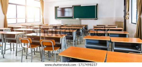 Empty
modern classroom with chairs, desks and
chalkboard.