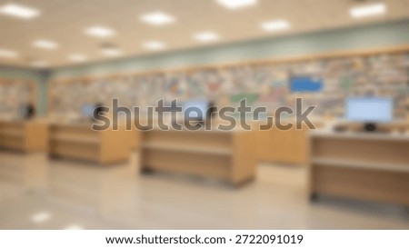 Empty Modern Classroom with Computers and Art Display.